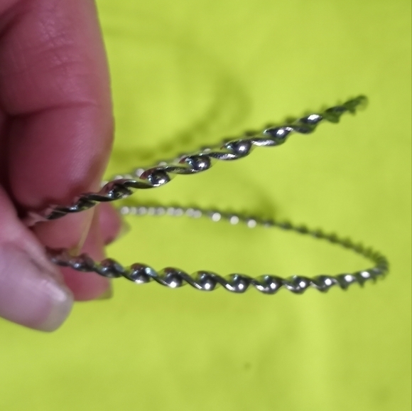 Pair of Silvertone twisted Bangle bracelets - Picture 2 of 3